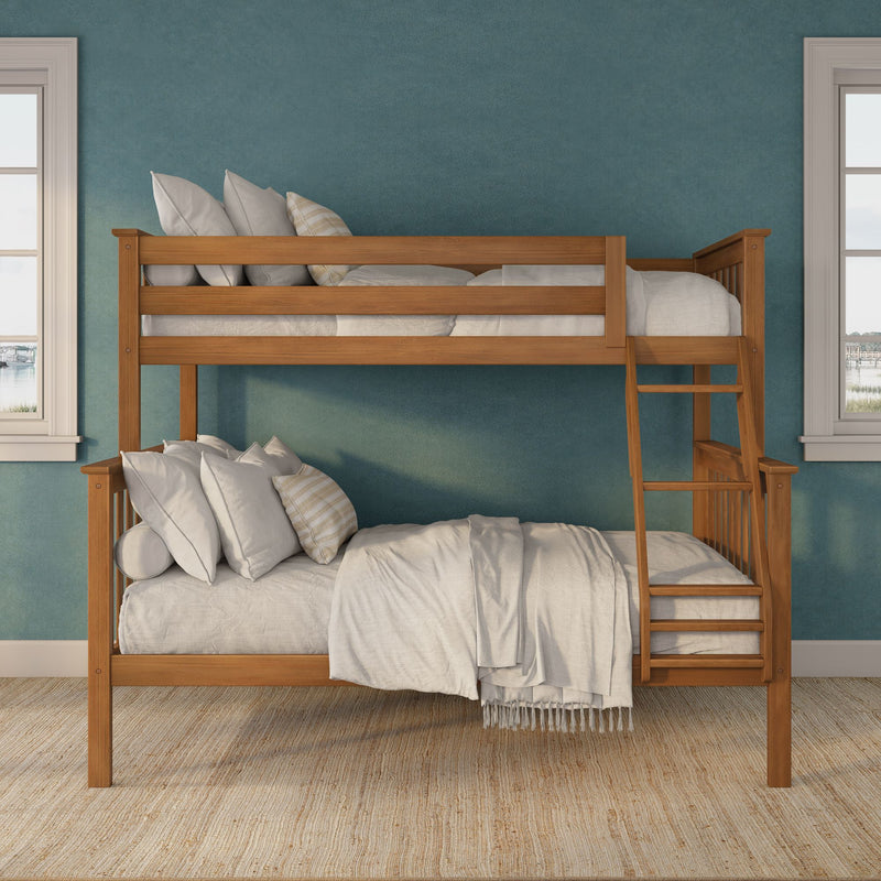 Wooden bunk bed with ladder and white linens in a coastal-style kids bedroom with teal textured wall and woven jute rug