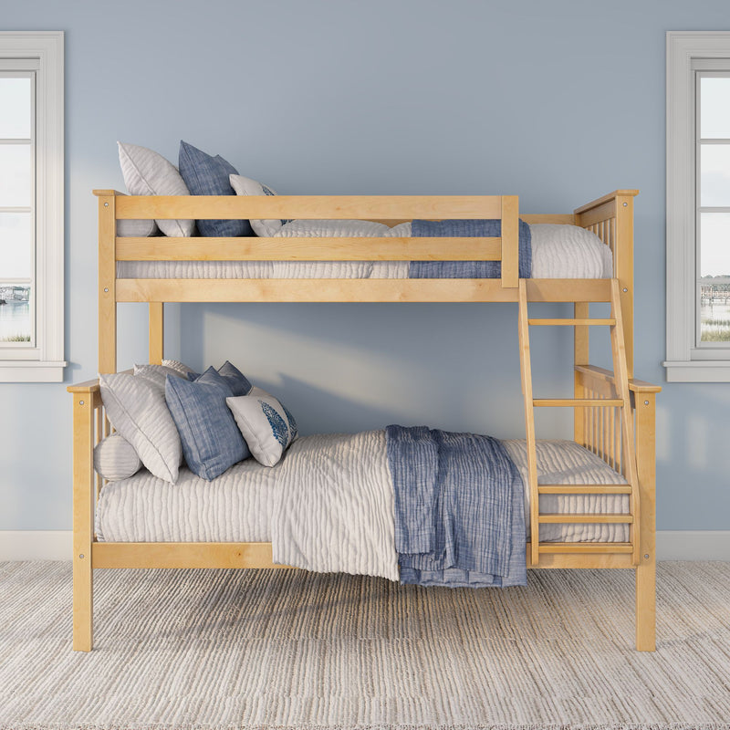 Light wood bunk bed with blue and white quilted bedding and pillows, ladder and windows in a modern kids' bedroom