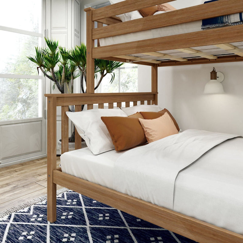 Wooden bunk bed with white and brown bedding in a bright room with natural light and wooden flooring.
