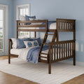 Solid wood twin-over-full bunk bed in walnut finish with ladder and guardrails, styled with blue-and-white coastal bedding in a light-blue kids' bedroom.