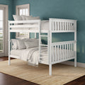 White wooden bunk bed with neutral linen bedding and ladder against a teal textured accent wall in a bright modern kids' bedroom with hardwood floor and jute rug