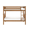 Solid wood twin-over-full bunk bed with built-in ladder and slatted headboards in warm oak finish, white mattresses — sturdy, space-saving children's bedroom furniture