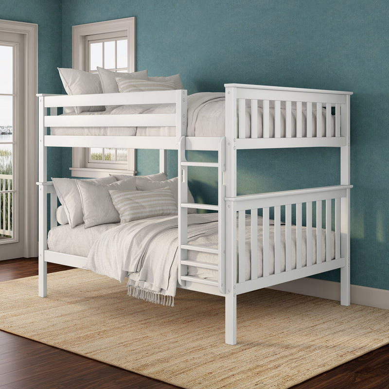 White wooden bunk bed with ladder in coastal kids' bedroom featuring teal textured wall, neutral linen bedding, jute rug and hardwood floors