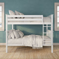 Modern white wooden bunk bed with ladder, neutral bedding and pillows against teal textured wall