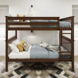 Wooden bunk bed with blue and white bedding, decorative pillows, and a geometric-patterned rug in a cozy bedroom.