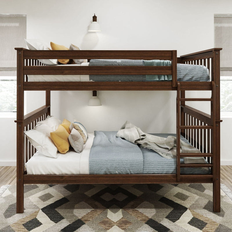 Wooden bunk bed with blue and white bedding, decorative pillows, and a geometric-patterned rug in a cozy bedroom.