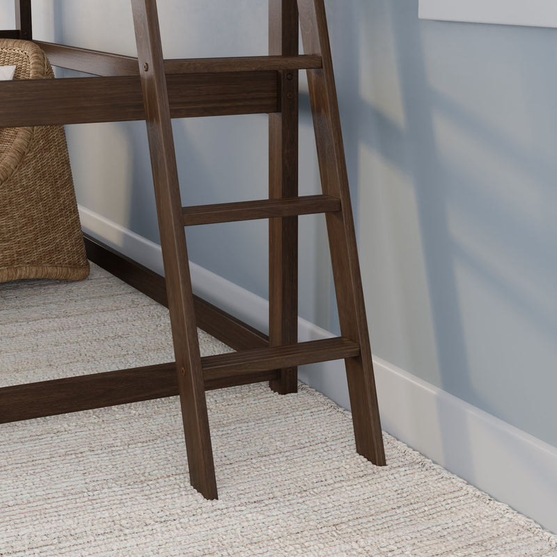 Rustic dark wood leaning ladder shelf beside woven wicker chair against a light blue wall on a textured neutral rug, modern farmhouse home decor