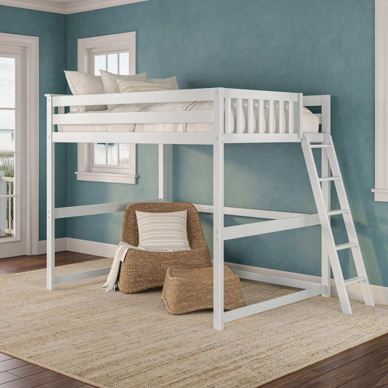 White loft bed with ladder in coastal-style bedroom, teal textured walls, wicker armchair with striped pillow, natural jute rug and water view through windows