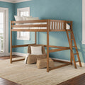 Wooden loft bed with ladder in coastal-style bedroom: twin loft bed with white bedding, blue textured walls, wicker chair and natural jute rug by sunlit windows