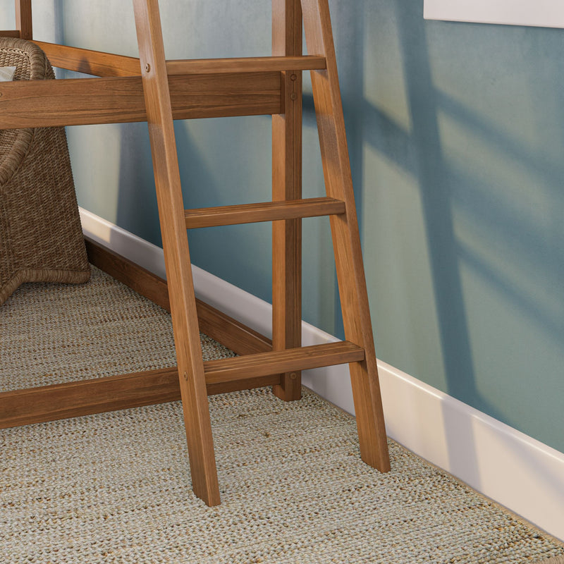 Leaning wooden ladder against a teal painted wall beside a woven wicker chair and textured jute rug — modern coastal bedroom decor