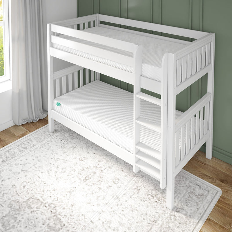 White wooden bunk bed in a bright room with a green wall and striped sheets.