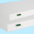 Stack of two gel mattresses with textured white covers on a blue background.