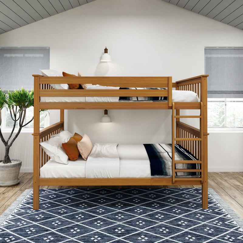 Wooden bunk bed in modern bedroom with decorative pillows and patterned area rug.