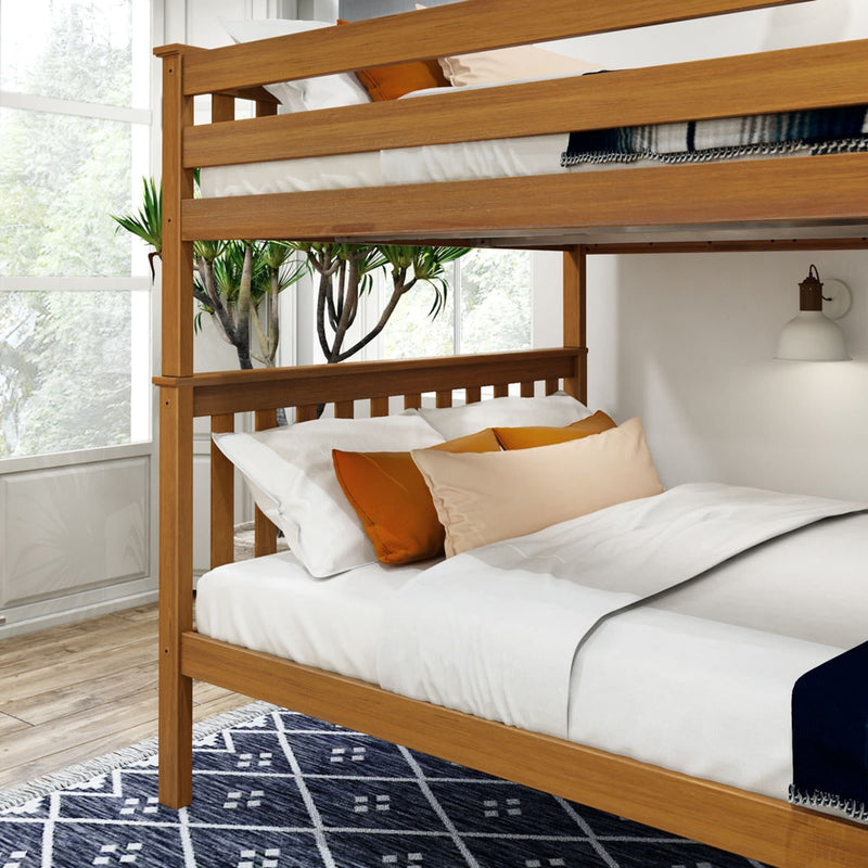 Wooden bunk bed with orange and beige pillows in a bright modern bedroom setting.