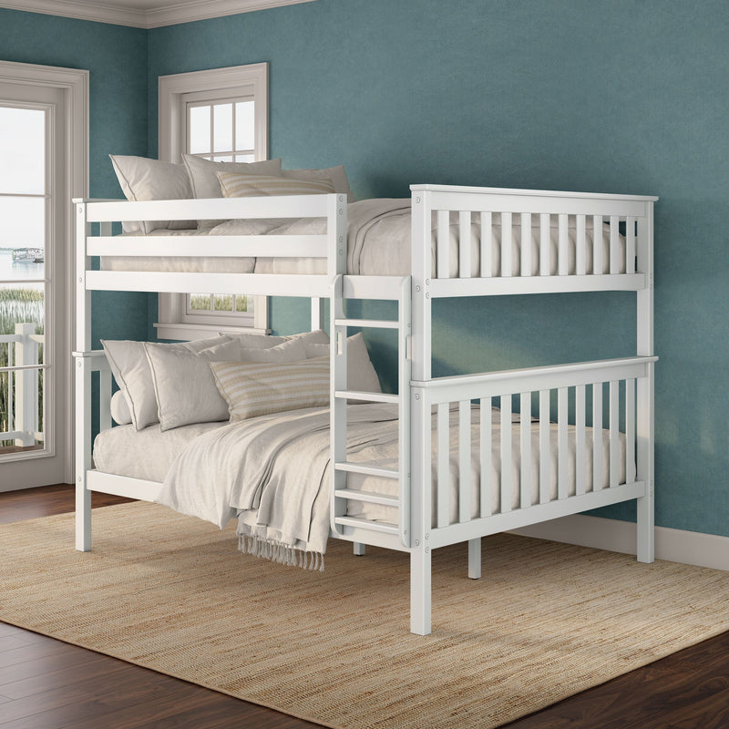 White wooden bunk bed with neutral linens in a coastal bedroom featuring a teal textured accent wall, large windows with harbor view, natural jute rug and hardwood floors