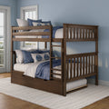 Dark wood two-level bunk bed with ladder and pull-out trundle drawer, styled with blue and white coastal bedding in a light-blue kids' bedroom