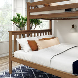 Modern wooden bunk bed with white bedding and decorative pillows in a bright room.