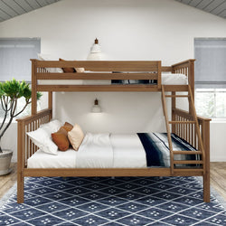 Wooden bunk bed with modern bedding in a bright, cozy bedroom featuring a stylish area rug.