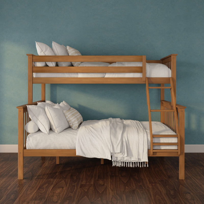 Solid wood bunk bed with ladder, white bedding and pillows against a teal textured wall on dark hardwood floor