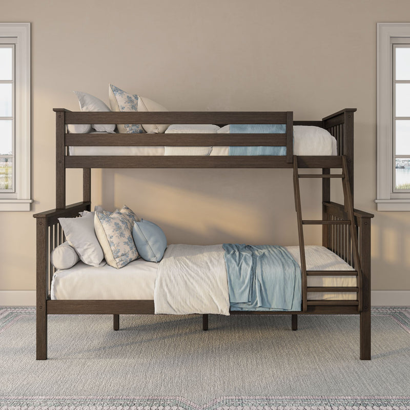 Dark wood bunk bed with ladder, blue and white bedding and floral pillows in a bright modern children's bedroom
