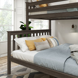 Modern wooden bunk bed with plush pillows in a sunlit bedroom.