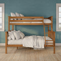 Wooden bunk bed with ladder and neutral white bedding against a teal textured wall in a bright kids bedroom with windows and woven jute rug
