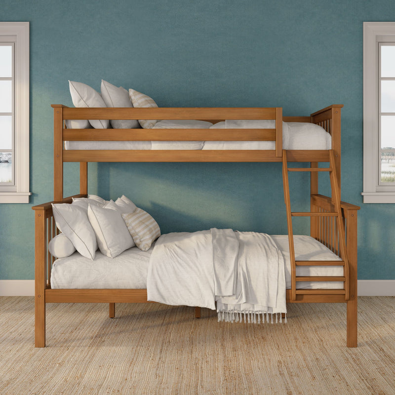 Wooden bunk bed with ladder and neutral white bedding against a teal textured wall in a bright kids bedroom with windows and woven jute rug