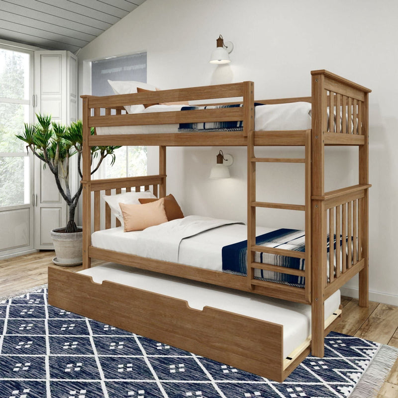 Modern wooden bunk bed with trundle in a bright bedroom featuring a blue patterned rug and large window.