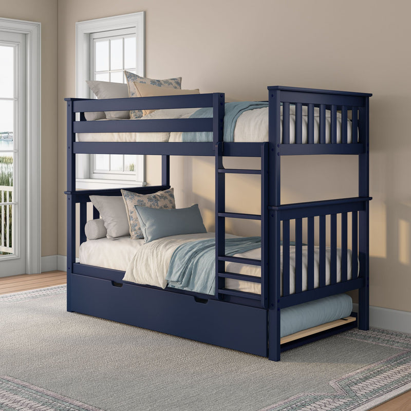Space-saving navy blue wooden bunk bed with pull-out trundle and ladder, styled with blue and cream bedding in a sunlit bedroom near windows