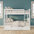 White wooden bunk bed with ladder and under-bed storage drawer in a bright kids' bedroom with teal textured wall and neutral bedding