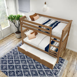 Wooden bunk bed with a pull-out trundle in a modern bedroom featuring a blue geometric rug and natural light from large windows.
