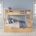 Natural wood twin-over-twin bunk bed with blue and white quilts and pillows, ladder and under-bed storage against a light blue wall with windows