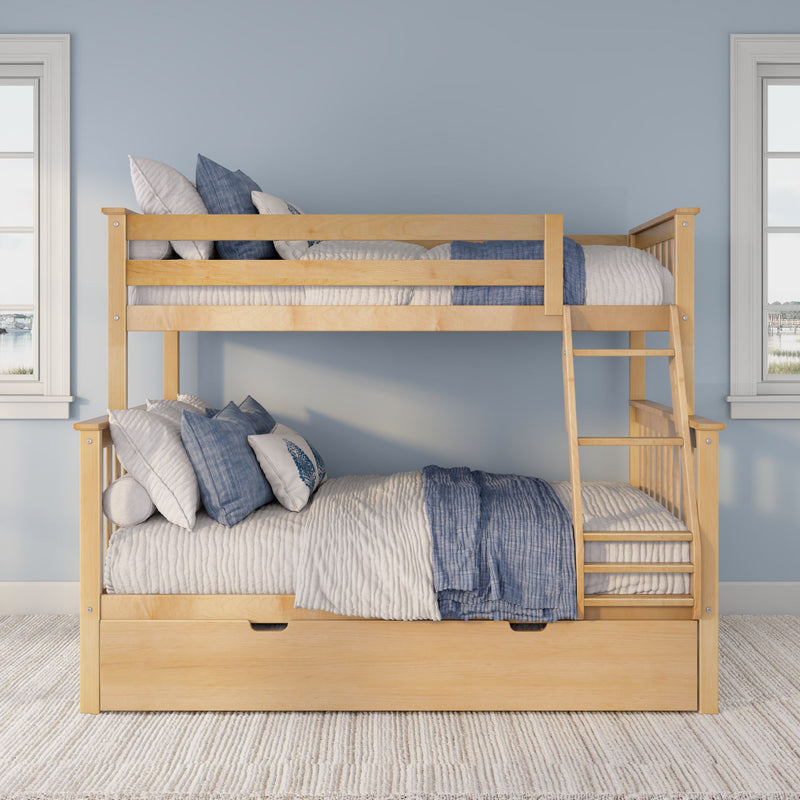 Natural wood twin-over-twin bunk bed with blue and white quilts and pillows, ladder and under-bed storage against a light blue wall with windows