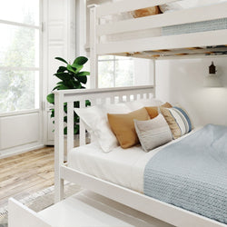 Stylish white bunk bed in a modern bedroom with cozy pillows and natural light.