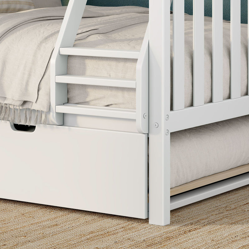 White wooden bunk bed ladder close-up with safety rails, beige linen bedding and under-bed storage drawer on jute rug