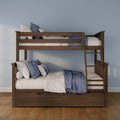 Solid wood bunk bed with ladder and under-bed storage, styled with blue and white quilted bedding in a light-blue kids' bedroom