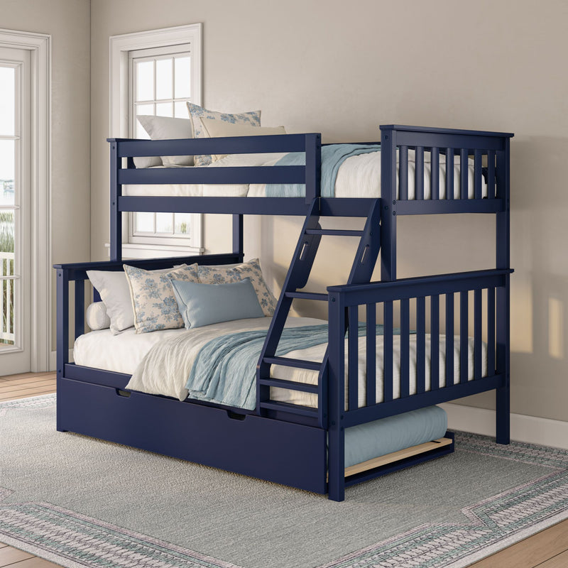 Navy blue wooden bunk bed with ladder and pull-out trundle, white and blue bedding and floral pillows in a bright coastal kids' bedroom
