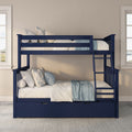 Navy blue wooden bunk bed with ladder and under-bed storage drawer, layered white and light-blue bedding and floral pillows in a neutral kids' bedroom