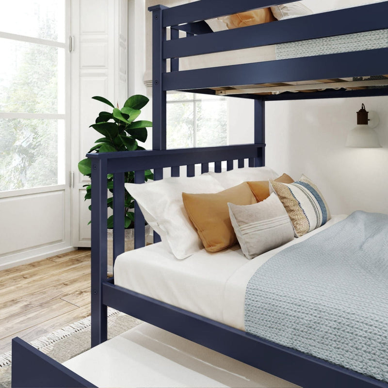 Modern navy blue bunk bed with cozy bedding and decorative pillows in a bright, stylish bedroom setting.