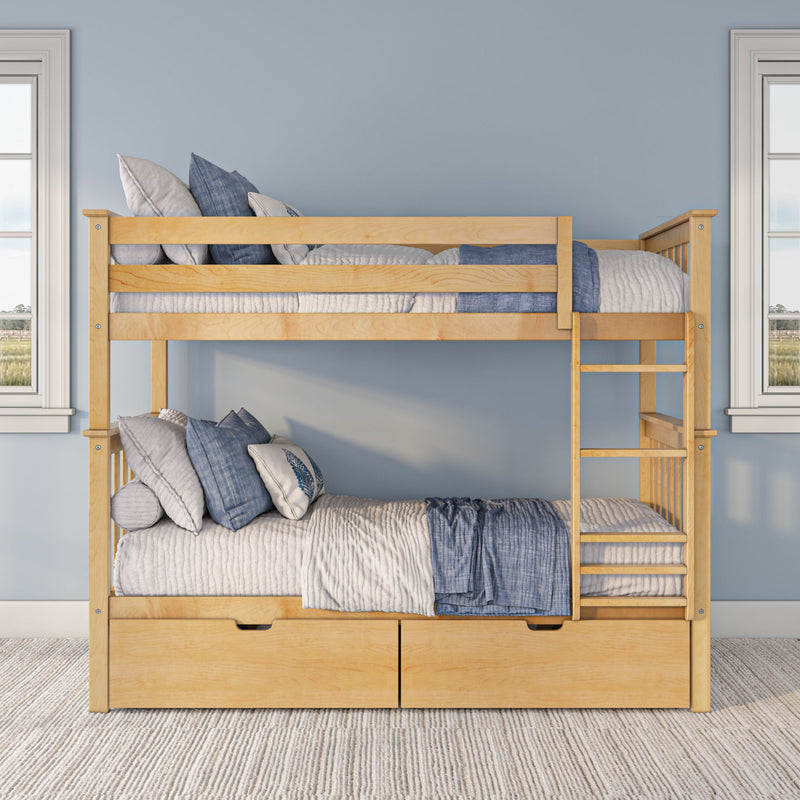 Natural wood twin-over-twin bunk bed with ladder and under-bed storage drawers dressed in blue and white quilted bedding and pillows in a coastal modern kids' bedroom