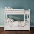 White wooden bunk bed with built-in storage drawers, neutral linens and pillows against a teal textured wall in a modern kids' bedroom