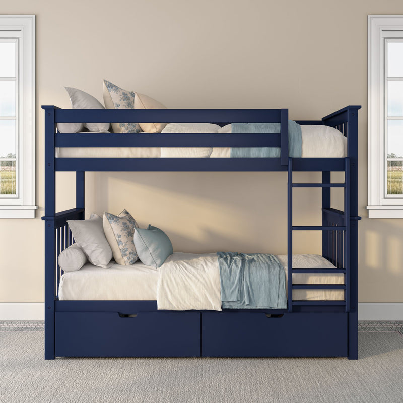 Navy blue twin-over-twin wooden bunk bed with ladder, built-in storage drawers and light-blue pillows and blanket in bright kids' bedroom