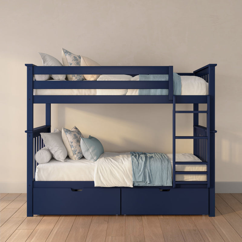 Navy blue wooden twin bunk bed with ladder, under-bed storage drawers and light blue pillows on white bedding in kids' bedroom