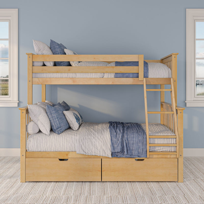 Natural wood bunk bed with ladder and under-bed drawers, styled with blue and white coastal bedding and pillows against a light blue wall with twin windows