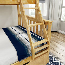Wooden bunk bed with blue and white striped blanket in a bright bedroom.