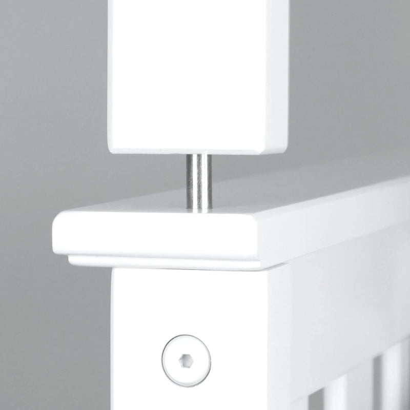 Close-up of a white stair gate attachment mechanism for child safety.