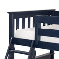 Close-up of navy blue wooden bunk bed guardrail and ladder with white quilted mattress
