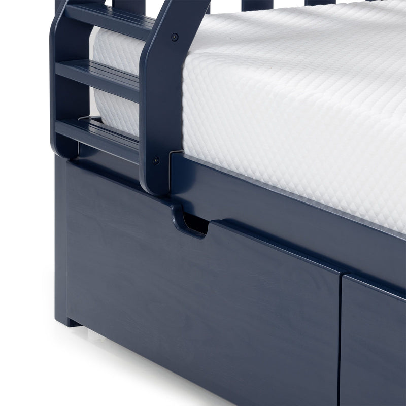 Navy blue wooden bunk bed ladder and guardrail with white textured mattress and under-bed storage drawer