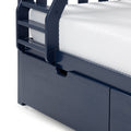 Navy blue wooden bunk bed ladder and guardrail with white textured mattress and under-bed storage drawer