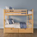 Modern natural wood bunk bed with ladder and under-bed storage drawers, styled with blue and white bedding and pillows in a kids' bedroom